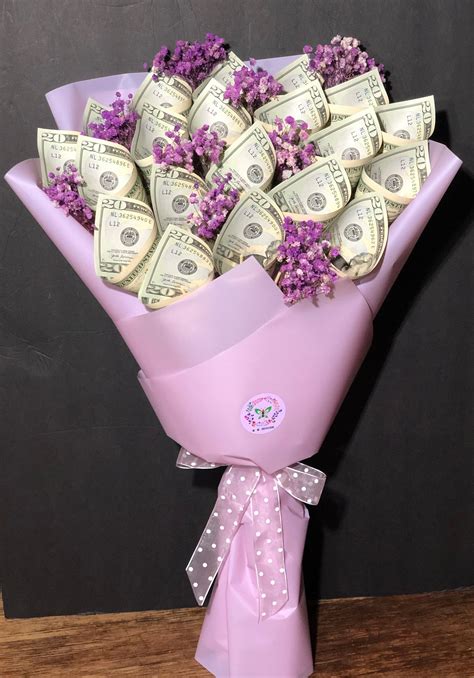 ) Fold each of your flowers. . Birthday money bouquet